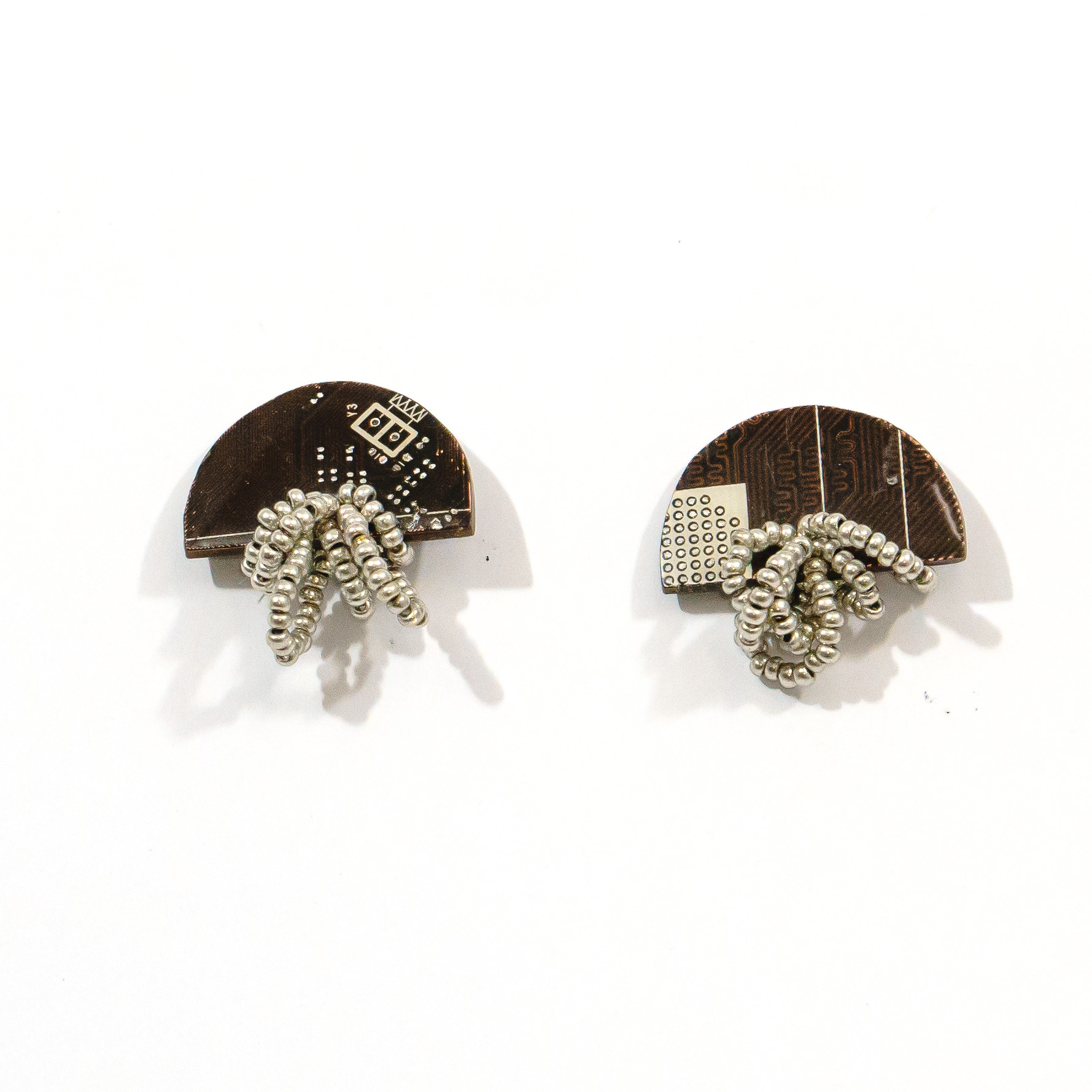 Arcade Earrings made from recycled PCBs and metallic beads in black, green, blue, red, and yellow, with stainless steel hooks.