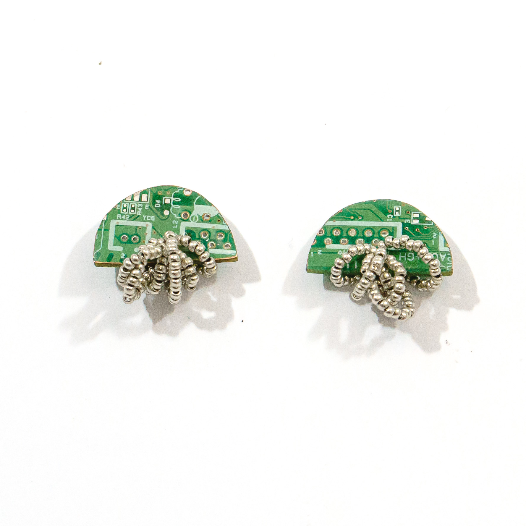 Arcade Earrings made from recycled PCBs and metallic beads in black, green, blue, red, and yellow, with stainless steel hooks